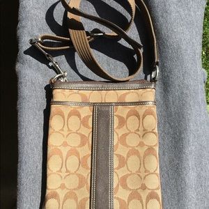 Coach handbag with adjustable shoulder strap